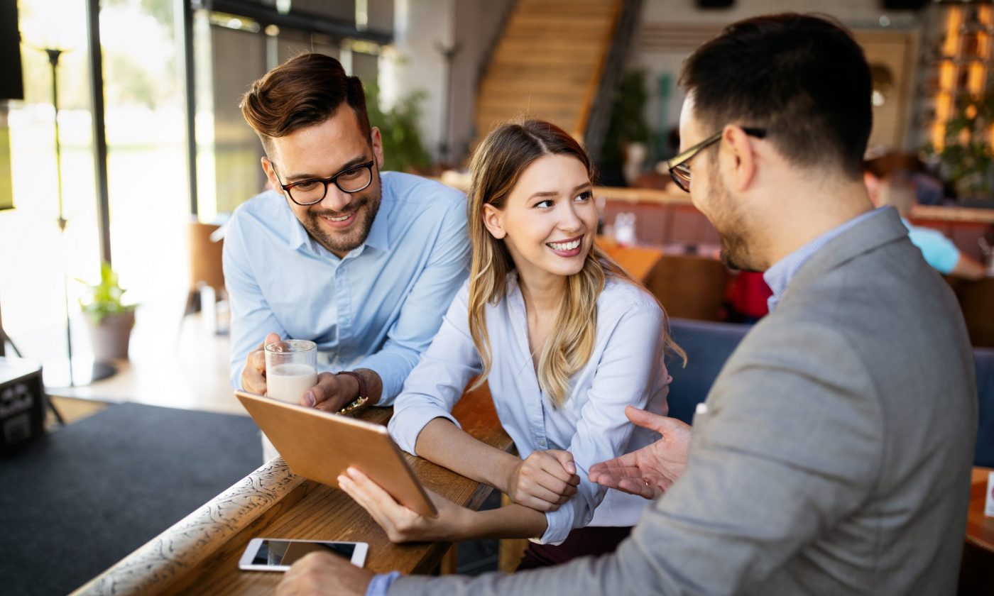 Coworker business colleagues working together in cafe